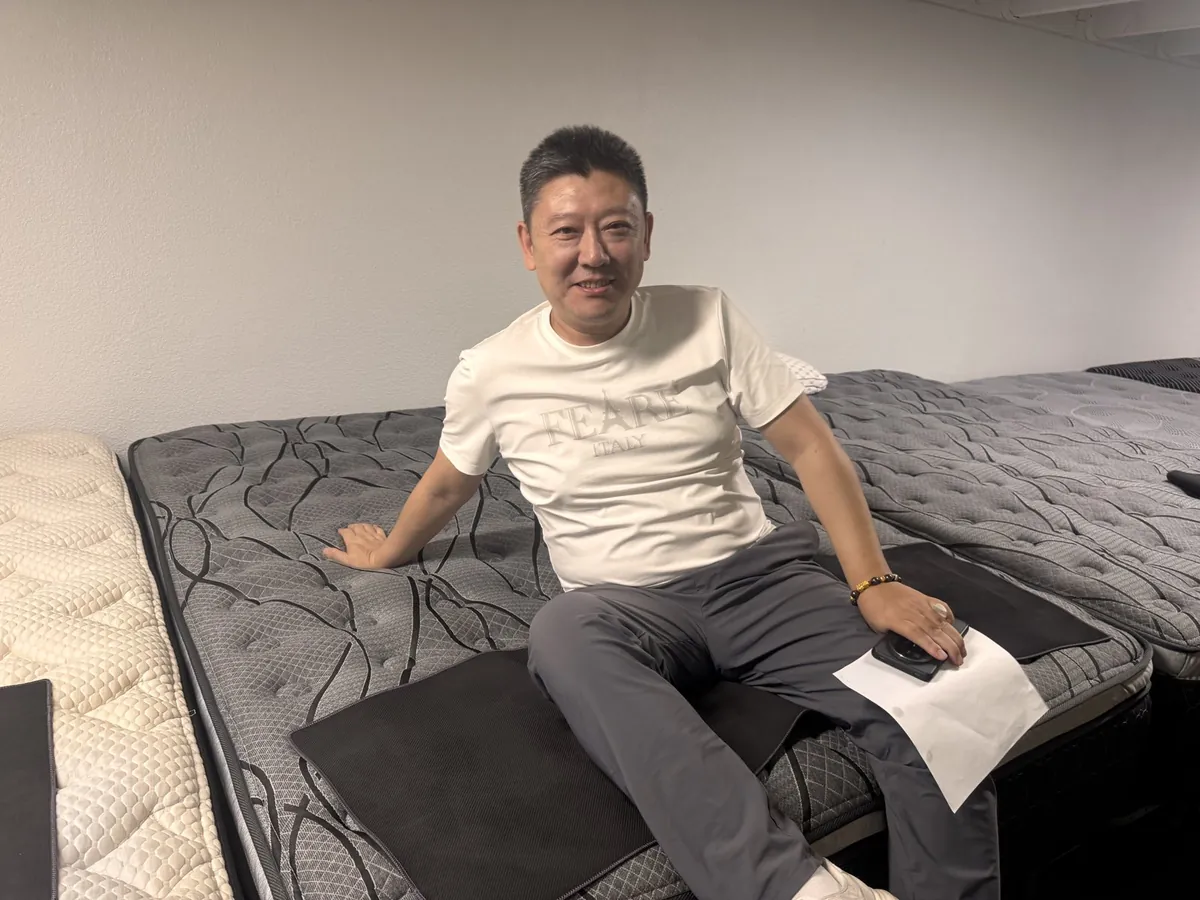 Customer trying a mattress at our Elk Grove showroom