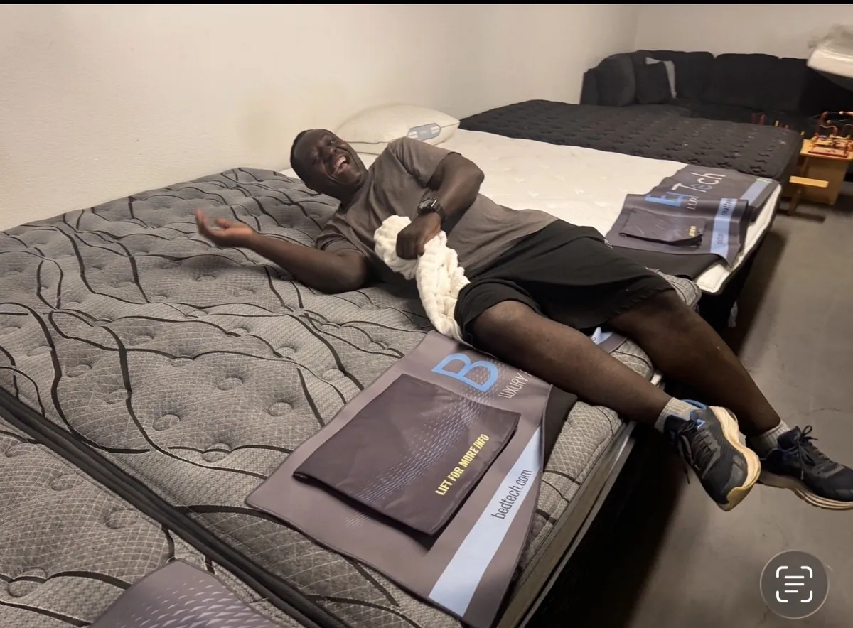Happy customer with a new mattress from our Elk Grove store